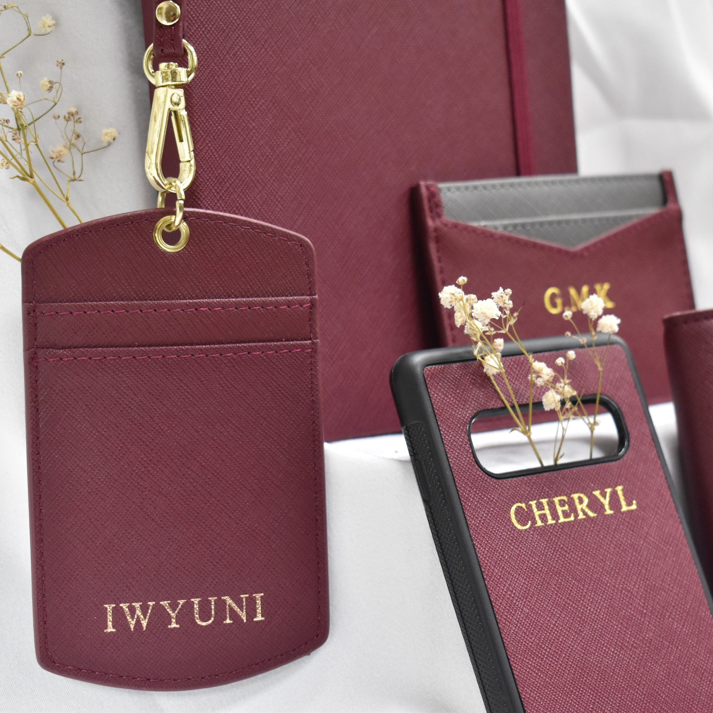a collection of personalised gifts for her including leather cardholders phone cases and notebooks