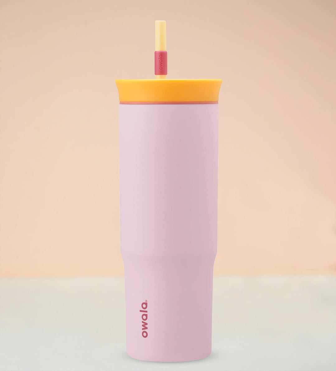 Pink water bottle with straw