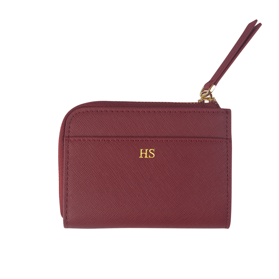 Burgundy custom Saffiano leather zip wallet with gold “HS” text.