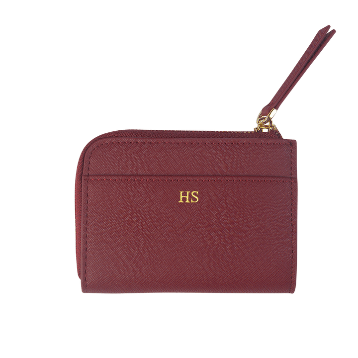 Burgundy custom Saffiano leather zip wallet with gold “HS” text.