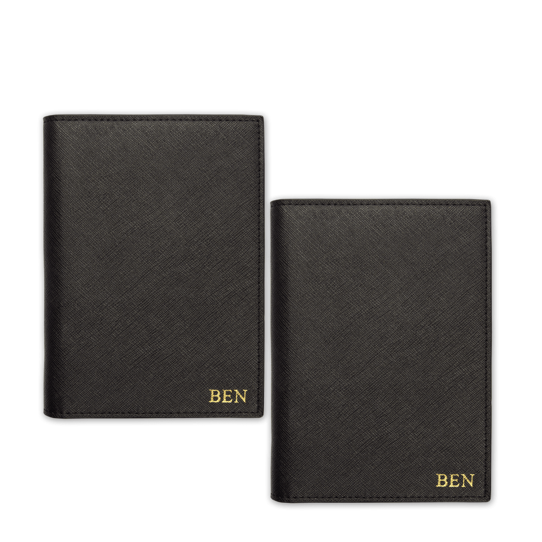 Two passport covers in black with gold ben text
