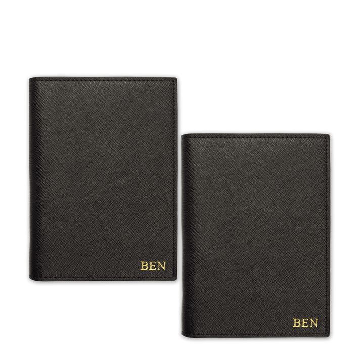 Two passport covers in black with gold ben text