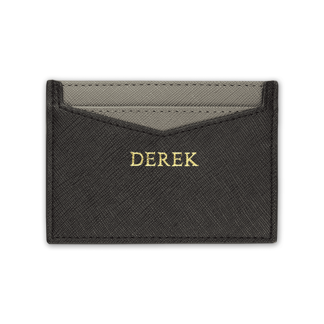 Black personalised Saffiano leather cardholder with gold “DEREK” text.