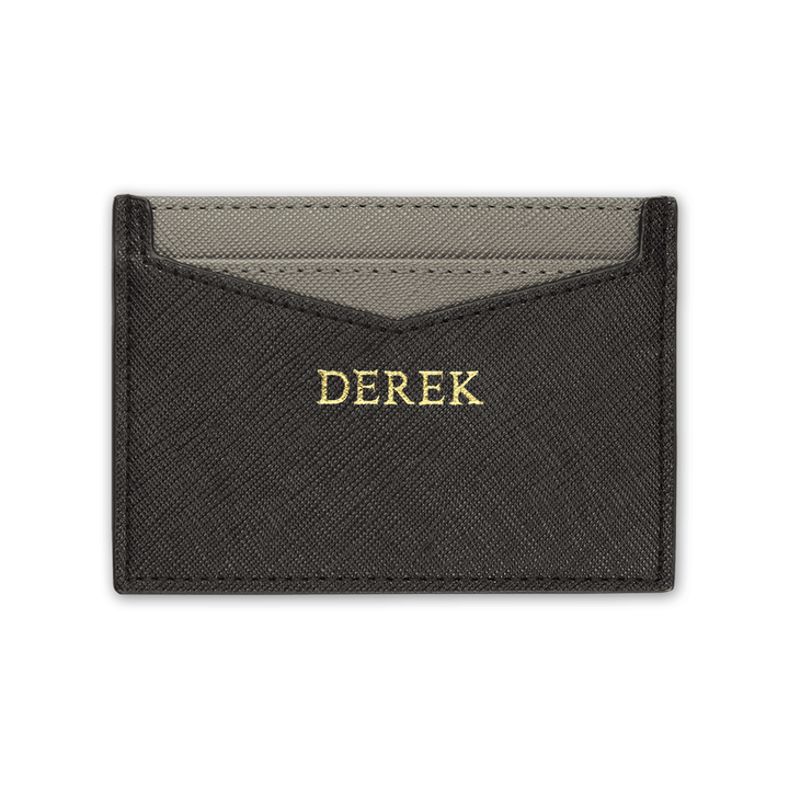 Black personalised Saffiano leather cardholder with gold “DEREK” text.