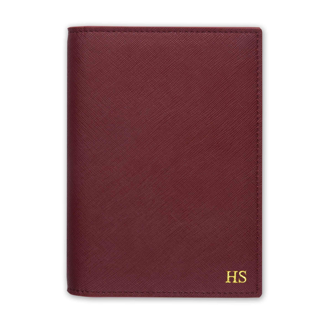 Saffiano passport cover in burgundy with gold HS text