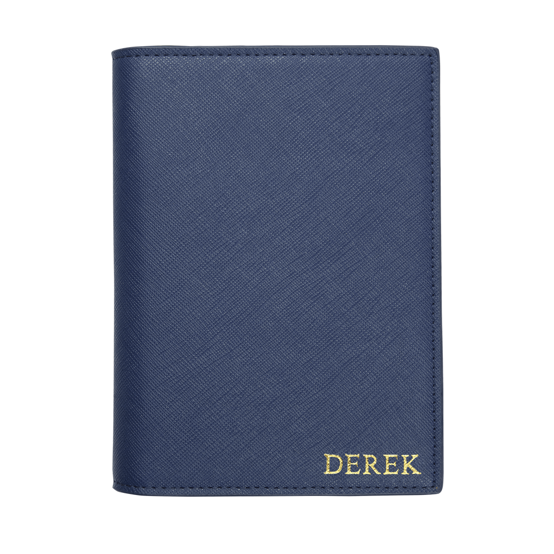 Saffiano passport cover in navy with gold derek text