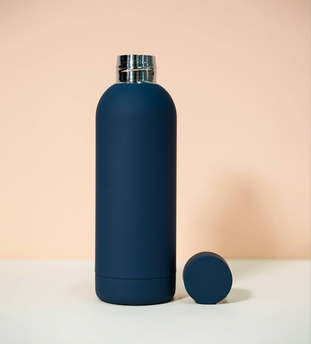 Blue thermal water bottle with blue lid